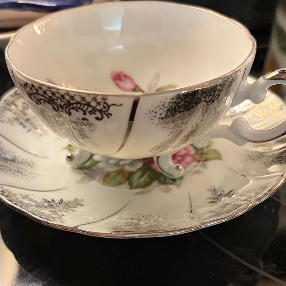 Vintage 3 footed tea cup made in Japan roses with silver guild. Rare!